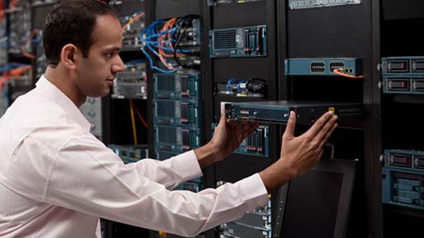 Man working with networking hardware