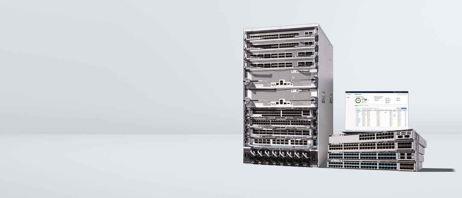 Cisco modular chassis and stacked switches with a laptop displaying a network management dashboard.