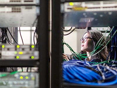 Image of a woman working in a data center